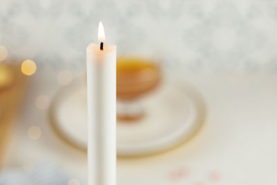 Close-up of illuminated candle