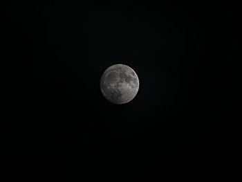 Low angle view of moon against clear sky at night