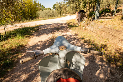 Man riding bicycle on dirt road