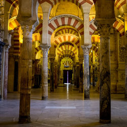 Illuminated corridor of historic building