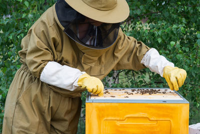 Rear view of man working in park