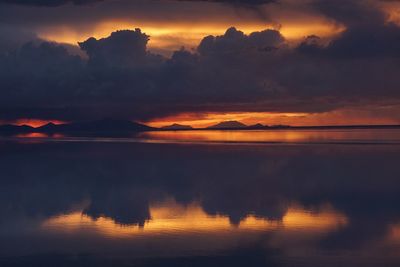 Scenic view of lake against romantic sky at sunset