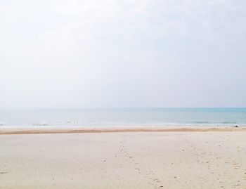 Scenic view of beach against clear sky