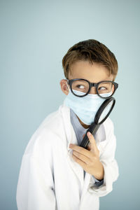 Portrait of doctor holding thermometer