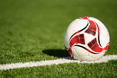 Close-up of soccer ball on field