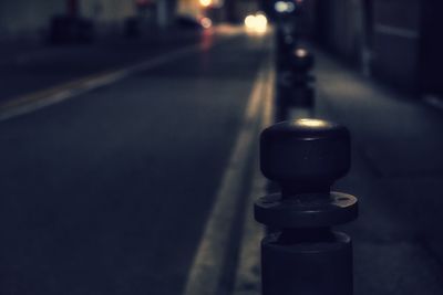 Close-up of illuminated lamp in city