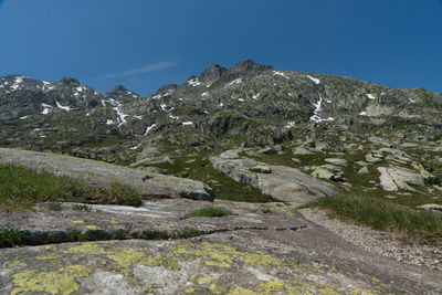 Scenic view of rocky mountains against clear blue sky