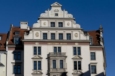 Low angle view of building against blue sky