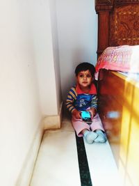 Portrait of cute boy smiling at home