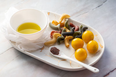 High angle view of fruits in plate on table