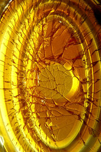 Close-up of glass over water against white background