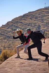 Happy mature couple hiking in peru and having fun