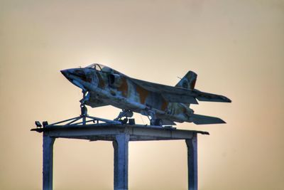 Low angle view of a bird against clear sky