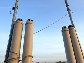 Low angle view of smoke stack against sky