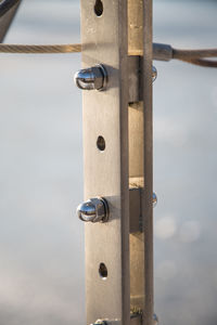 Close-up of metal chain on railing