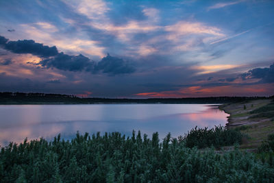 Scenic view of lake against sky during sunset