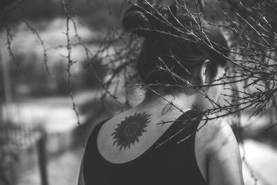 Close-up of woman against plants