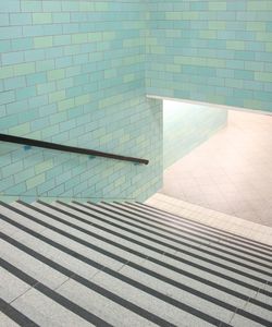 High angle view of steps by swimming pool against building