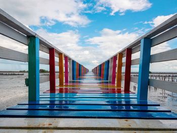 Empty bridge against blue sky