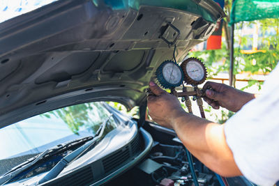 Midsection of man driving car