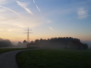 Scenic view of field against sky during sunset