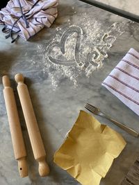 Pasta with love in high angle with heart written in flour 