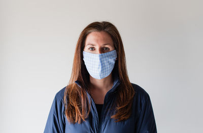 Woman wearing homemade cloth face mask during covid 19 pandemic.