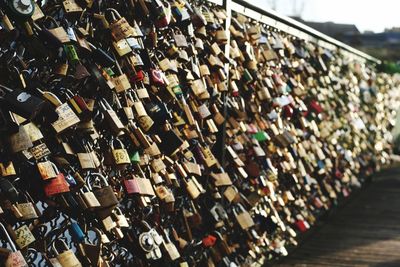 Padlocks hanging on pont des arts bridge railing