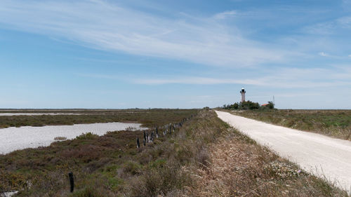 View of lighthouse on road against sky