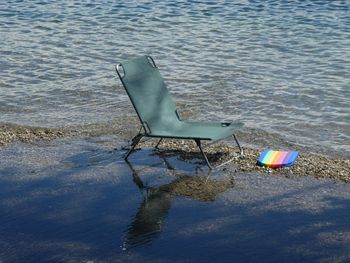 High angle view of chair on beach