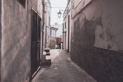 Narrow alley along buildings