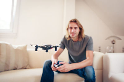 Young man using a drone