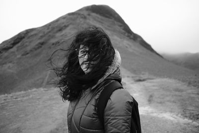 Portrait of woman against mountains