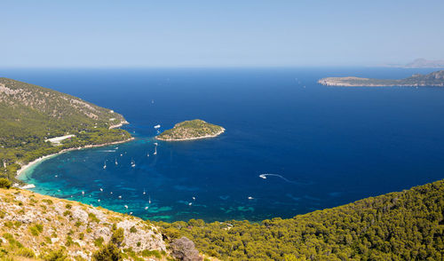 High angle view of sea and rocks against sky