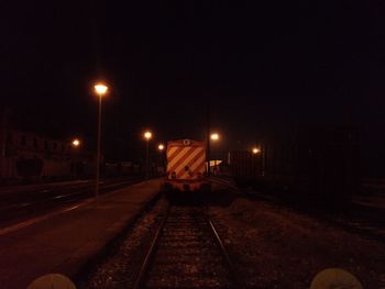 Train on railroad track at night