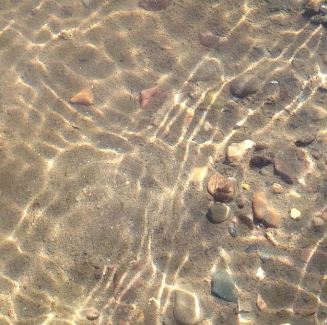 FULL FRAME SHOT OF SAND WITH RIPPLED WATER