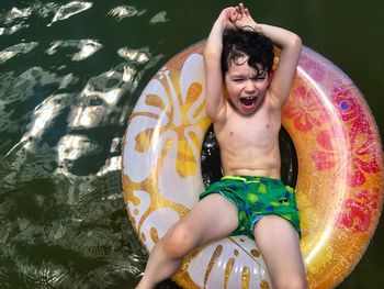 Portrait of a smiling young woman in water