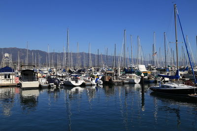 Boats moored at harbor