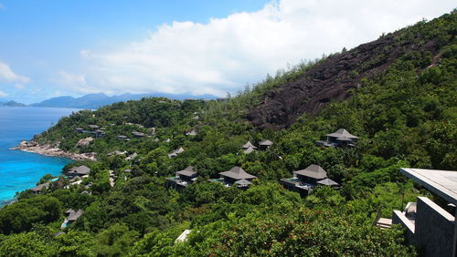 Scenic view of sea and buildings against sky