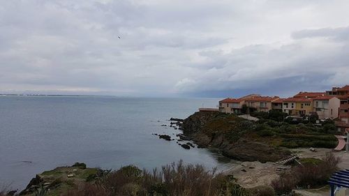 Scenic view of sea against cloudy sky