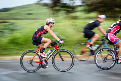 Side view of man riding bicycle