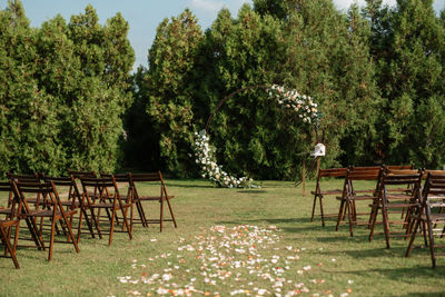 Empty chairs on field