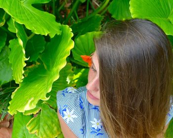 Close-up of woman amidst plants