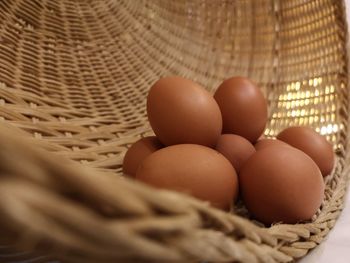 Close-up of eggs in wicker basket
