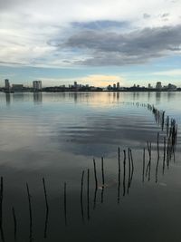 Scenic view of lake against sky at dusk