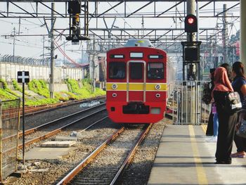 Train at railroad station against sky