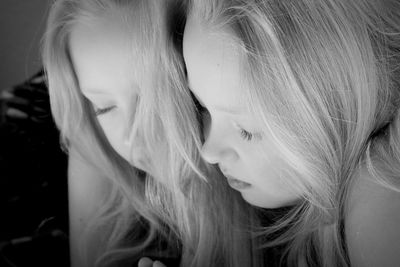 Close-up of girl against mirror