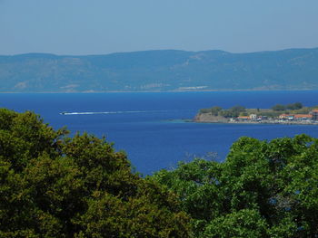 Scenic view of sea against clear blue sky