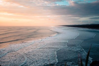 Scenic view of sea against sky during sunset