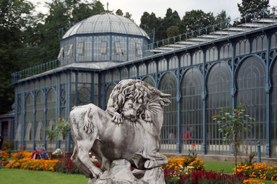 Statue in front of building